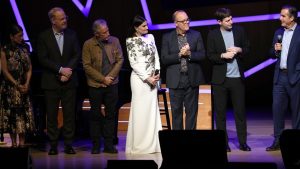 Caroline Hirsch, Jim Gaffigan, Jon Stewart, Idina Menzel, Tom Papa and Alex Edelman