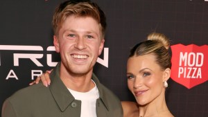 Robert Irwin and Witney Carson smiling at an event