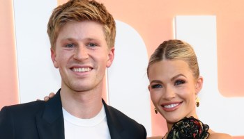 Robert Irwin and Witney Carson smiling at an event