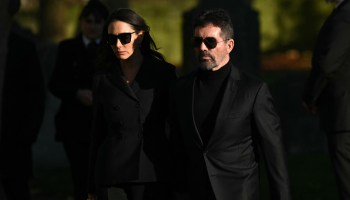 Simon Cowell and Lauren Silverman wearing sunglasses